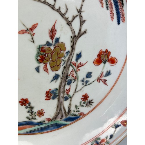 81 - A 19TH CENTURY CHINESE PLATE DECORATED WITH A HORSE AND FLOWERS, 

22cm diameter.