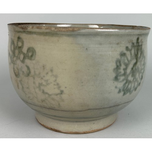 71 - A SOUTHEAST ASIAN BOWL DECORATED WITH FLOWERS,

Possibly 17th century or earlier. 

17cm x 12cm