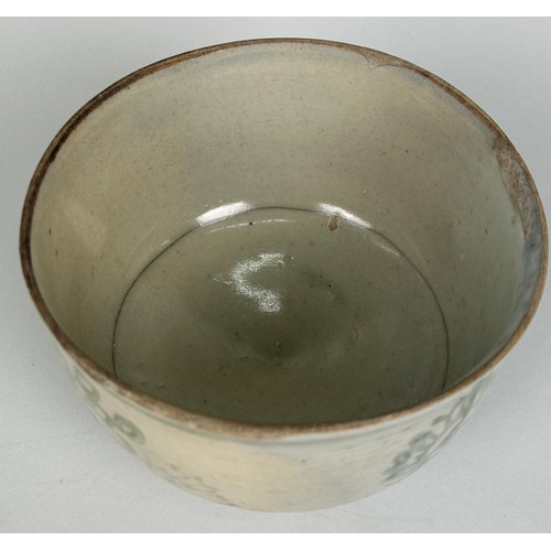 71 - A SOUTHEAST ASIAN BOWL DECORATED WITH FLOWERS,

Possibly 17th century or earlier. 

17cm x 12cm