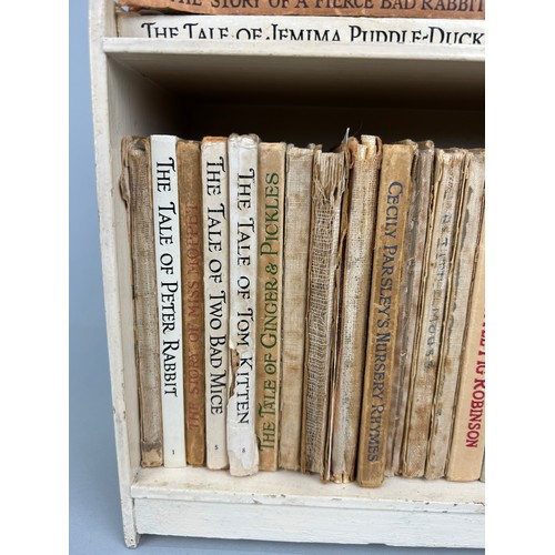 316 - A COLLECTION OF 29 PETER RABBIT BOOKS WITH ORIGINAL PETER RABBITS BOOK CASE CIRCA 1940

29 books in ... 