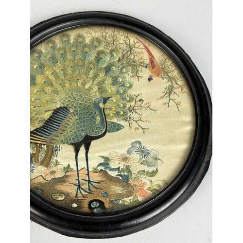 92 - A 19TH CENTURY CHINESE CIRCULAR SILK PANEL DEPICTING A PEACOCK AMONGST FOLIAGE, 

15cm in diameter 
... 