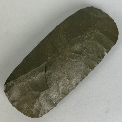 239 - A NEOLITHIC GREEN JASPER FLAKED ADZE FROM THE AIR MOUNTAINS, NIGER,

12cm x 5cm