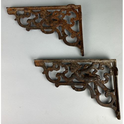 507 - APAIR OF IRON CORNER BRACKETS WITH CHERUBS,  

37cm X 25cm each