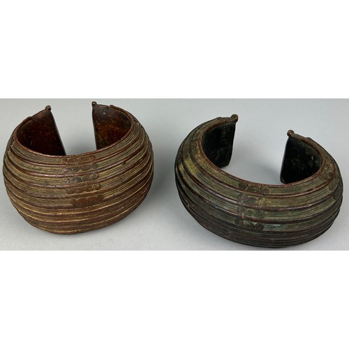 127 - TWO AFRICAN TRIBAL COPPER CURRENCY BANGLES POSSIBLE BOULE, 

Total weight: 1295gms 

Largest 12cm x ... 