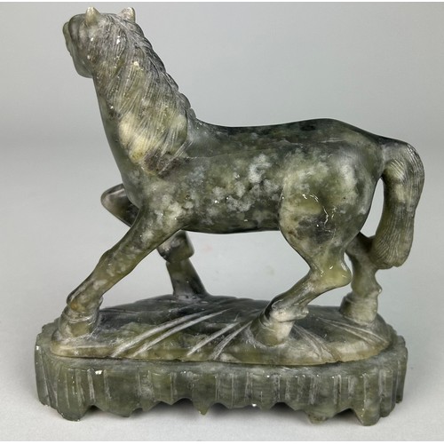 42 - A CHINESE JADE COLOURED STONE FIGURE OF A HORSE, 

16cm x 15cm