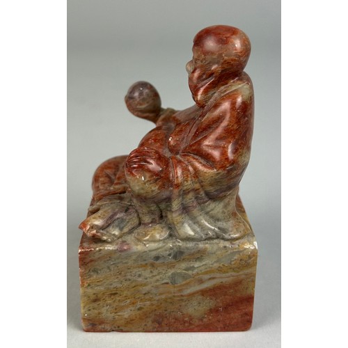 87 - A CHINESE SOAPSTONE FIGURE OF A SEATED BUDDHA, 

9cm x 5cm