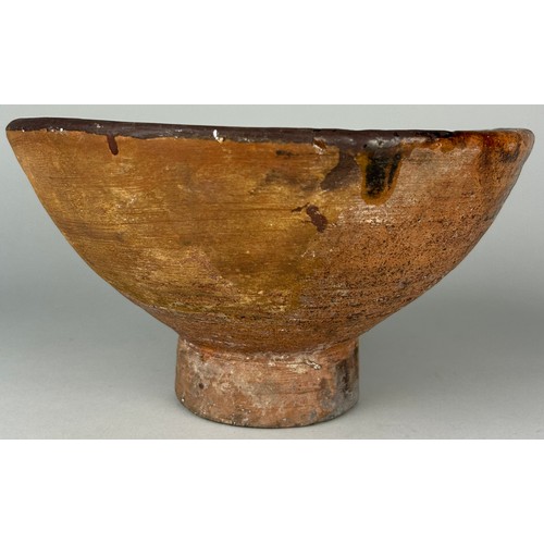 45 - A 14TH CENTURY MAMLUK SLIPWARE POTTERY FOOTED BOWL, 

24cm x 13cm 

Provenance: Purchased by the cur... 