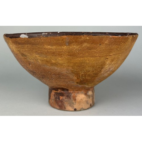 45 - A 14TH CENTURY MAMLUK SLIPWARE POTTERY FOOTED BOWL, 

24cm x 13cm 

Provenance: Purchased by the cur... 