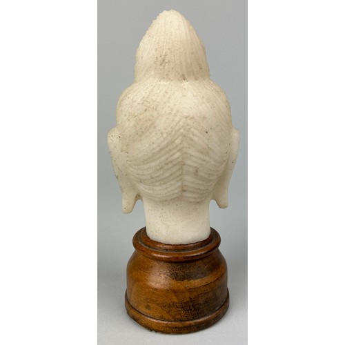 85 - A CHINESE MARBLE HEAD OF A GUANYIN ON STAND,

11cm x 7cm