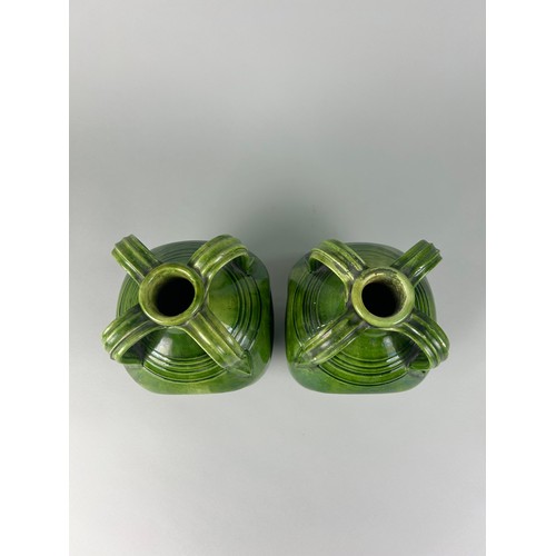 355 - A PAIR OF ART NOUVEAU FOUR HANDLED GREEN GLAZED LUSTRE CERAMIC JUGS, 

24cm x 15cm