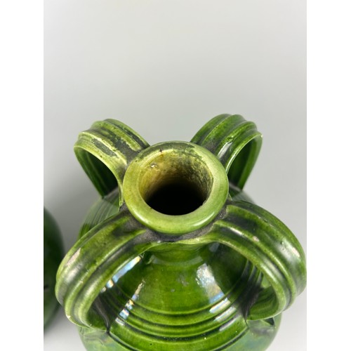 355 - A PAIR OF ART NOUVEAU FOUR HANDLED GREEN GLAZED LUSTRE CERAMIC JUGS, 

24cm x 15cm