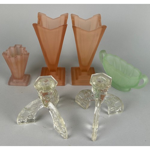 335 - A COLLECTION OF GLASS PEDESTAL VASES,

Green and pink along with a four armed crystal candelabra.