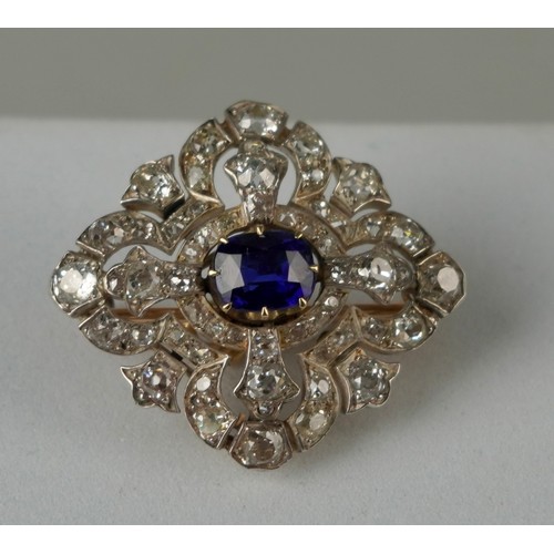 160 - A FINE 14CT GOLD BANGLE WITH CENTRAL CLAW SET SAPPHIRE SURROUNDED BY DIAMOND CLUSTERS,

Multi functi... 