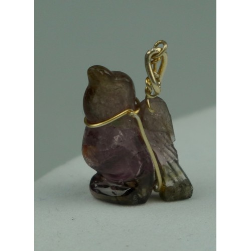 222 - A CARVED TOURMALINE BIRD PENDANT, 

Weight: 2.2gms 

20mm x 15mm