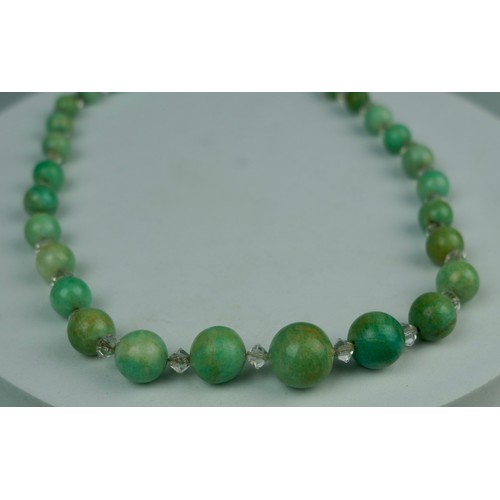 184 - A JADE NECKLACE WITH ROCK CRYSTAL AND YELLOW METAL CLASP, 

38.9gms