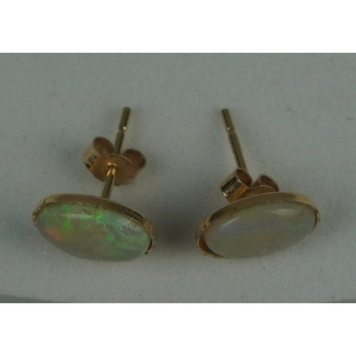 221 - A PAIR OF OPAL EARRINGS SET IN 9CT GOLD, 

Total weight: 0.72gms

10mm x 0.6mm each.