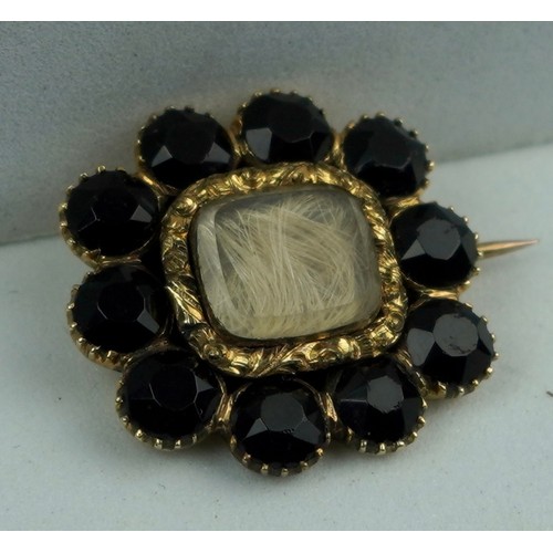 216 - GEORGIAN 18CT GOLD BLACK JET BROOCH 4.3gms