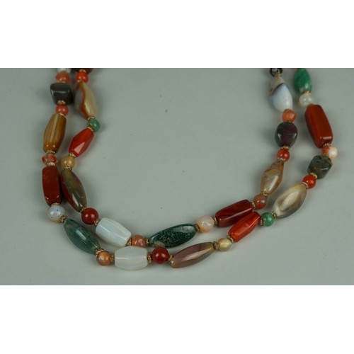 227 - A FINE SCOTTISH AGATE AND HARDSTONE NECKLACE COMPRISING EIGHT FIVE INDIVIDUAL STONES, 

Strung with ... 