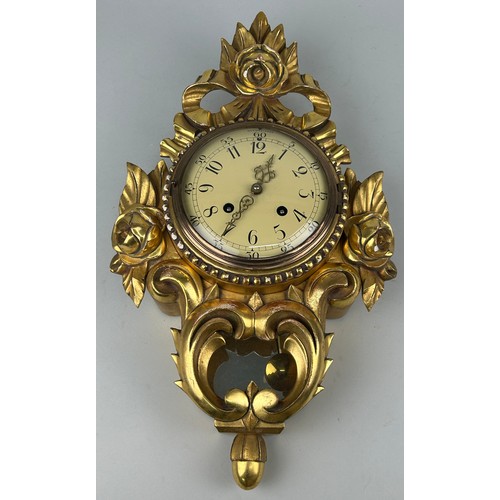 345 - A WESTERSTRAND GILTWOOD CLOCK WITH KEY,

In working condition. 

54cm x 30cm