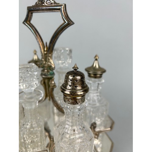 544 - A CUT GLASS CRUET SET WITH SILVER PLATED TOPS AND STAND,