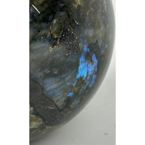 249A - A LABRADORITE SPHERE WITH STRIKING FLASHES OF GREEN AND BLUE,

11cm in diameter