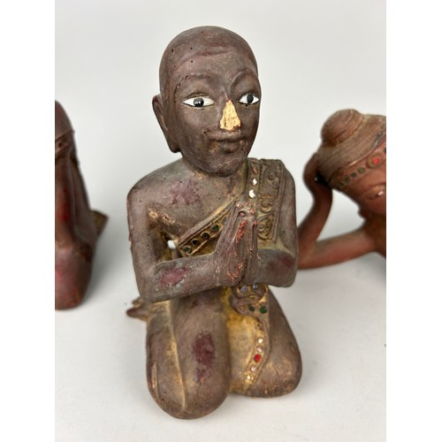 404A - A COLLECTION OF 20TH CENTURY FIGURES IN PRAYER, 

Largest 40cm L x 17cm H