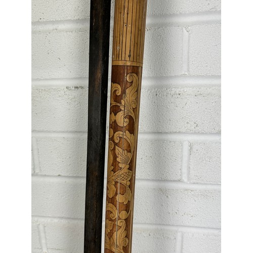 557 - A POLE FOR A JAPANESE HANGING SCROLL,

150cm in length.