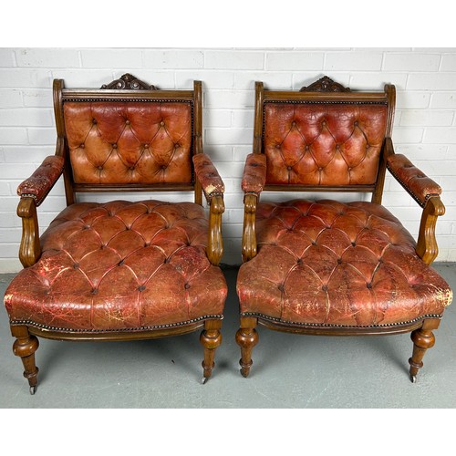 491 - A PAIR OF 19TH CENTURY BUTTON BACK FAUTEUILS, 

Each upholstered in red or tan leather, raised on fo... 