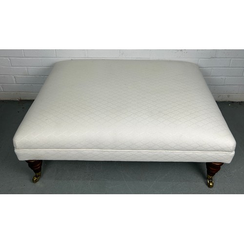 521 - A FOOTSTOOL OR CENTRE STOOL UPHOLSTERED IN NEUTRAL LINEN FABRIC, 

100cm x 75cm x 35cm