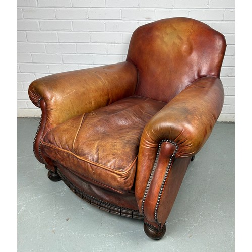 497 - A LARGE ART DECO TAN LEATHER CLUB CHAIR, 

85cm x 75cm x 75cm