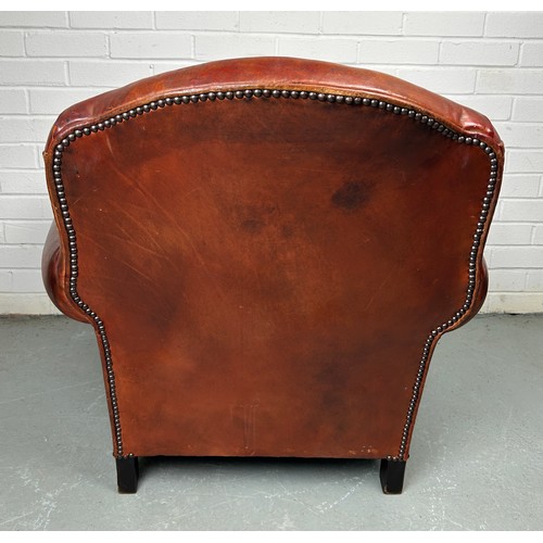 497 - A LARGE ART DECO TAN LEATHER CLUB CHAIR, 

85cm x 75cm x 75cm