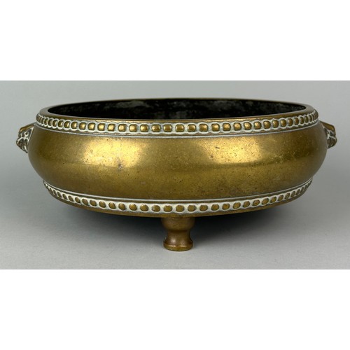 3 - AN 18TH OR 19TH CENTURY CHINESE BRONZE CENSER WITH LION HEAD HANDLES ON TRIPOD FEET, 

29cm W x 9cm ... 