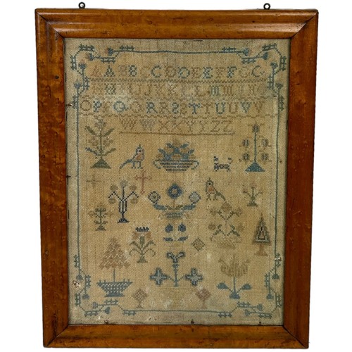 450A - A LARGE 19TH CENUTRY NEEDLEPOINT SAMPLER, 

40cm x 30cm 

Mounted in a burr walnut frame and glazed.