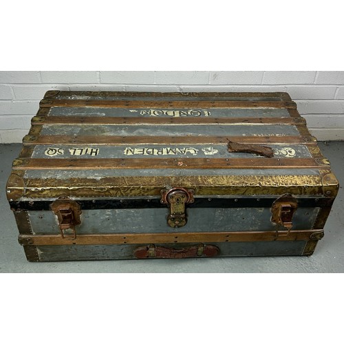 493 - A LARGE ZINC AND BRASS BOUND EXPLORERS TRUNK, 

92cm x 52cm x 33cm

Late 19th or early 20th Century,... 