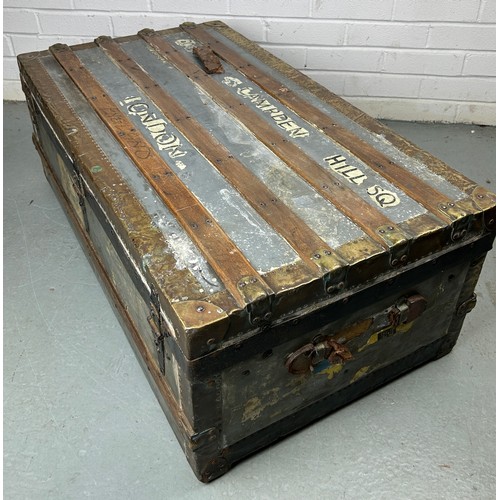 493 - A LARGE ZINC AND BRASS BOUND EXPLORERS TRUNK, 

92cm x 52cm x 33cm

Late 19th or early 20th Century,... 