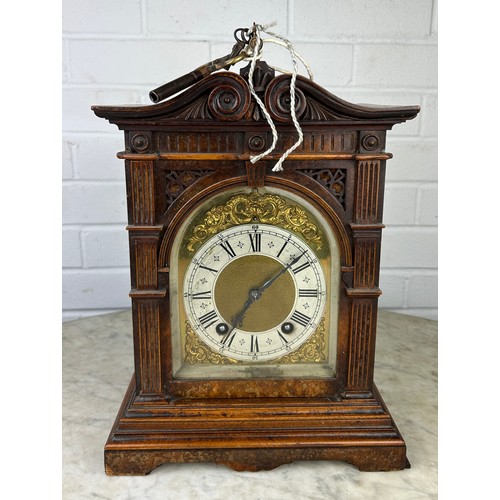 343 - AN ANTIQUE MANTEL CLOCK,