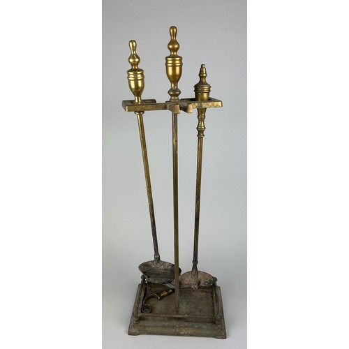 519 - A BRASS FIRE STAND AND TOOLS, 

70cm x 24cm