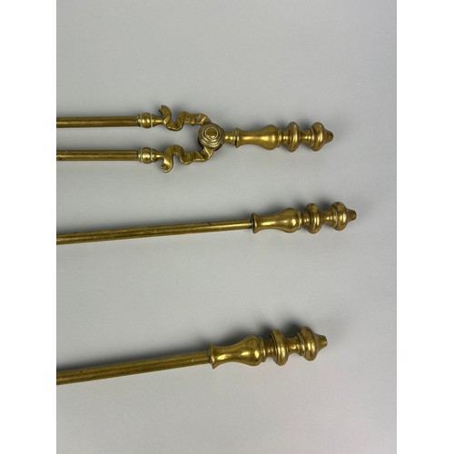 520 - THREE ANTIQUE BRASS FIRE TOOLS (3)