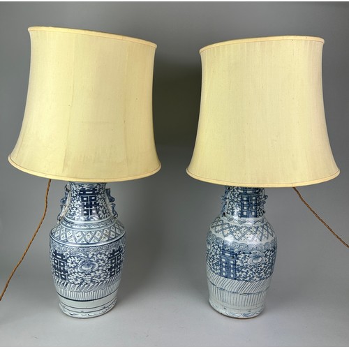 484 - A VERY NEAR PAIR OF LATE 19TH OR EARLY 20TH CENTURY CHINESE BLUE AND WHITE VASES ADAPTED AS TABLE LA... 