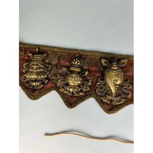 394 - A TIBETAN BELT WITH BRASS SYMBOLS,

71cm x 12cm