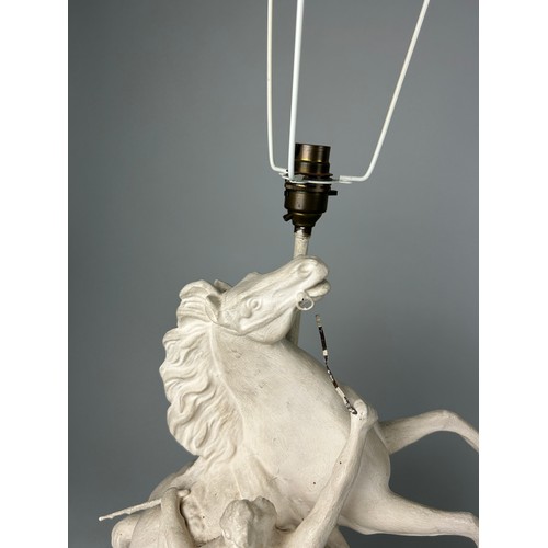 478 - EQUESTRIAN INTEREST: A PAIR OF WHITE PAINTED METAL LAMPS IN THE FORM OF A REARING HORSE AND TRAINER ... 