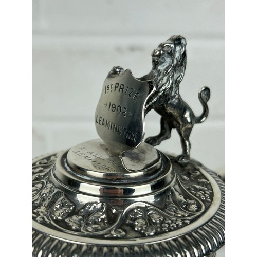 133A - A LARGE SILVER MOUNTED CLARET JUG WITH ENGRAVING '1ST PRIZE 1902 LEAMINGTON E.ALLCOCK LE MELLOR', 

... 