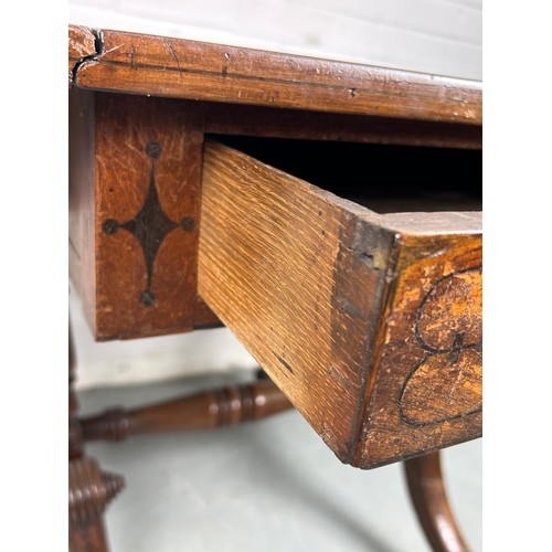 489 - AN EARLY 19TH CENTURY PEMBROKE TABLE WITH EBONY INLAY ON FOUR LEGS AND CASTORS, 

(some damage to ca... 