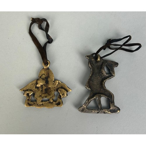 401 - TWO TIBETAN PENDANTS,

Largest 6cm x 4cm