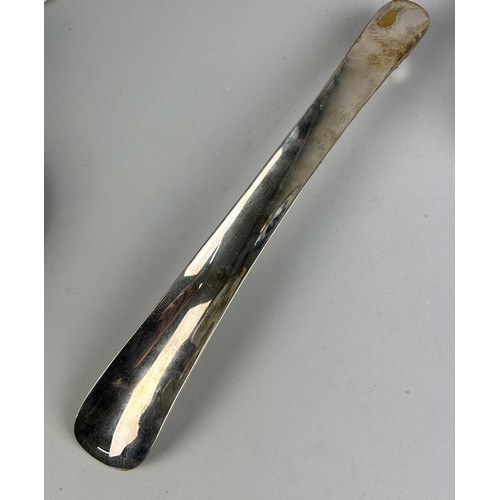 549 - A SILVER PLATED SHOE HORN,

35cm L