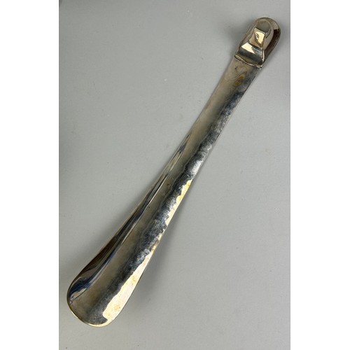 549 - A SILVER PLATED SHOE HORN,

35cm L