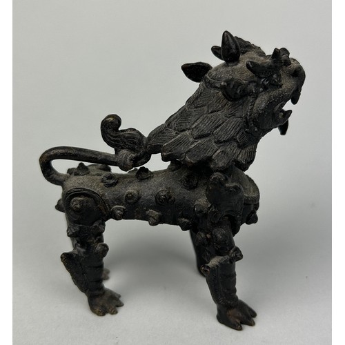 11 - A CHINESE BRONZE FIGURE OF A LION,

9cm x 9cm