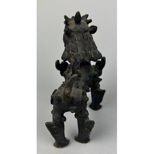 11 - A CHINESE BRONZE FIGURE OF A LION,

9cm x 9cm