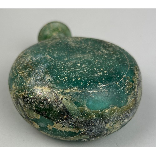 246A - A GREEN LUSTROUS FLASK BOTTLE POSSIBLY ROMAN, 

10cm x 8cm