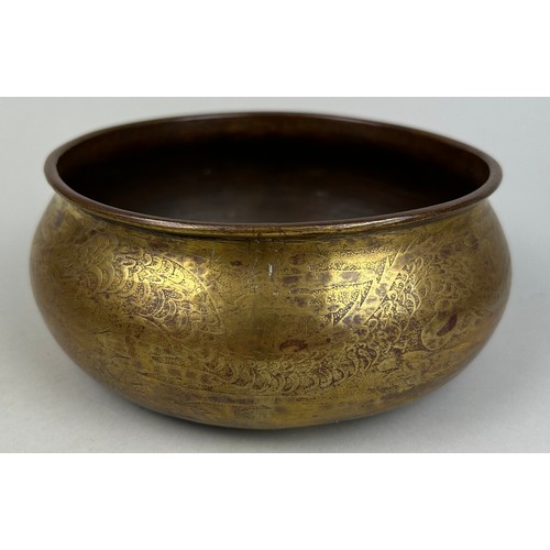 21 - A LARGE GILT COPPER BOWL DECORATED WITH A LARGE DRAGON ON TRIPOD FEET, 

16cm x 7cm